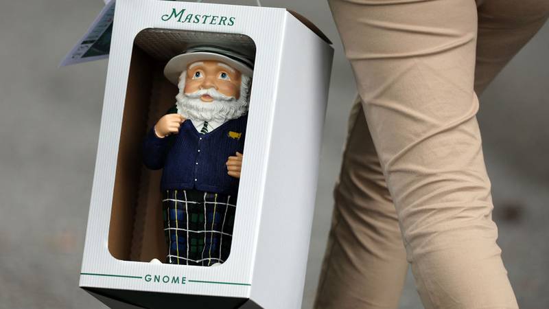 AUGUSTA, GEORGIA - APRIL 11: A patron holds a Masters Gnome during the first round of the 2024 Masters Tournament at Augusta National Golf Club on April 11, 2024 in Augusta, Georgia.  (Photo by Andrew Redington/Getty Images)
