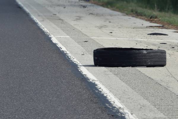 Tire flies off truck, hits another vehicle, flipping it